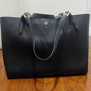 Dark blue Tory Burch tote. Some scratches at the bottom as seen in pictures